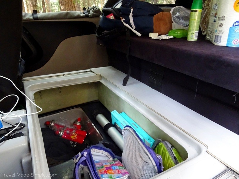 US road trip in campervan storage space open